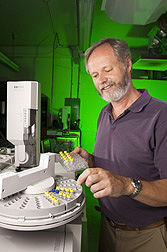 Photo: ARS chemist Hans Alborn loads an autosampler with vials of root compounds. Link to photo information
